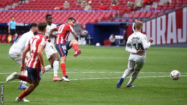 Angel Correa scores for Atletico Madrid against Huesca