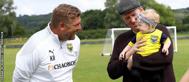 Karl Robinson meets a young fan