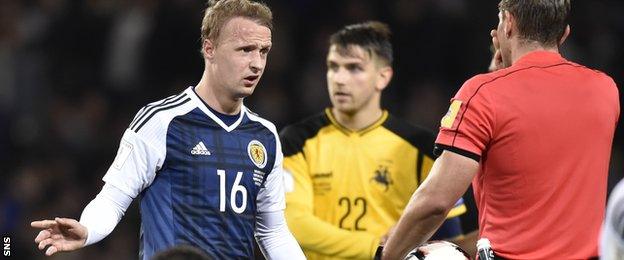 Scotland striker Leigh Griffiths speaks to the referee against Lithuania