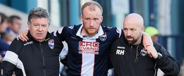 Ross County's Liam Boyce is carried off injured