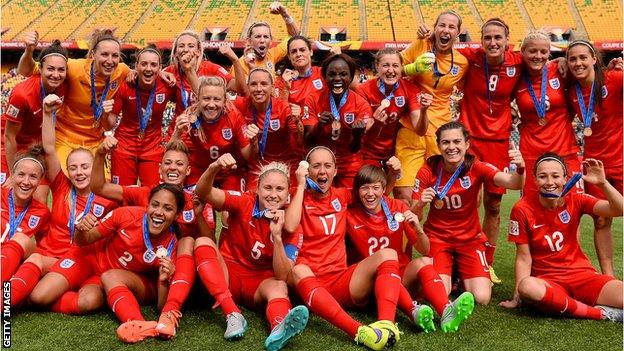 England celebrate winning bronze in Canada