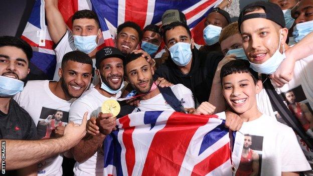 Boxer Galal Yafai celebrates with brother at Heathrow Airport