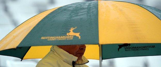 One Trent Bridge spectator waits patiently after rain stops play during the One-Day Cup quarter-final between Nottinghamshire and Durham