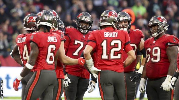 Tom Brady and his Tampa Bay Buccaneers in the huddle