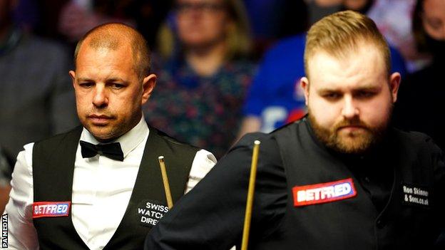 Jackson Page (R) beat 2013 World Championship runner-up Barry Hawkins on his Crucible debut this year