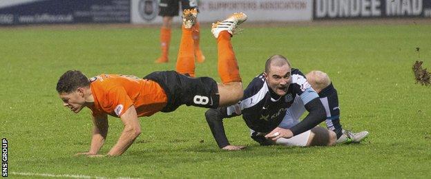 James McPake upends John Rankin during the Dundee derby