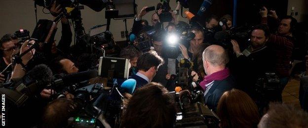 Lord Coe is surrounded by reporters in Munich