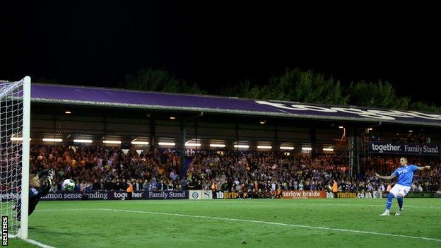 Stockport County's Antoni Sarcevic has his penalty saved by Leicester City's Daniel Iversen