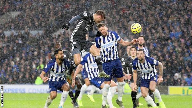 Jamie Vardy heads towards the Brighton goal