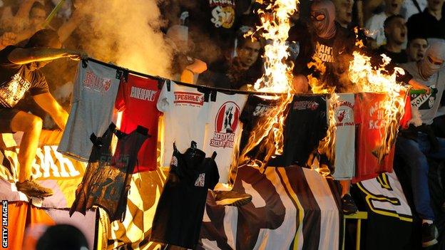 Partizan fans burning Red Star shirts in a September 2016 game