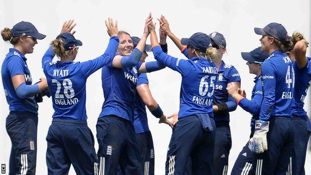 Beth Langston (third left) celebrates a wicket