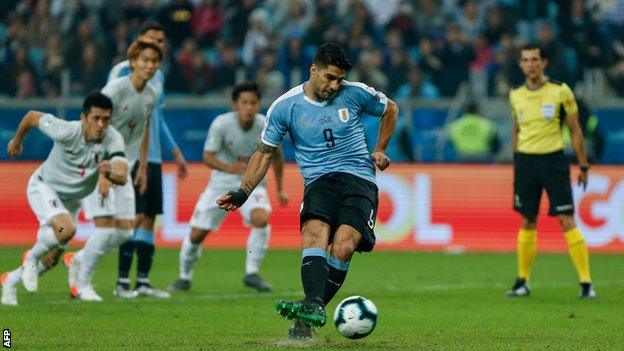 Luis Suarez scores a penalty against Japan