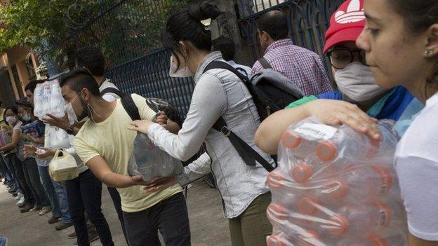 People help distribute supplies