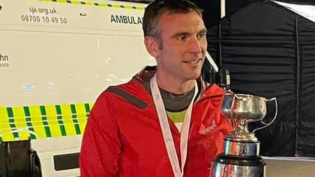 Paul Atherton holding the trophy