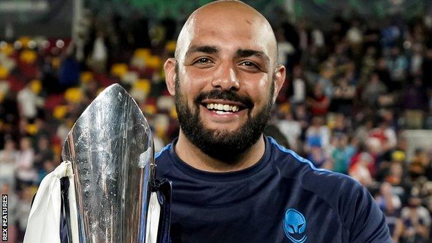 Kai Owen poses with the Premiership Rugby Cup trophy