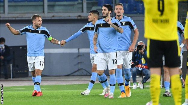 Ciro Immobile (left) celerbrates with Lazio team-mates