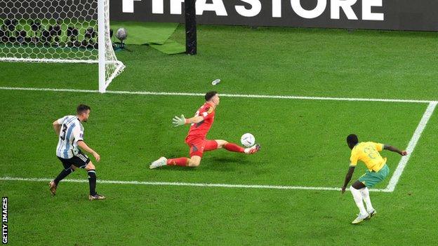 Emiliano Martinez of Argentina saves the shot by Garang Kuol of Australia during the FIFA World Cup Qatar 2022 Round of 16 match between Argentina and Australia