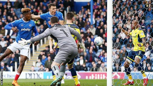 Kal Naismith nets Portsmouth's opening goal past Oxford United keeper Simon Eastwood