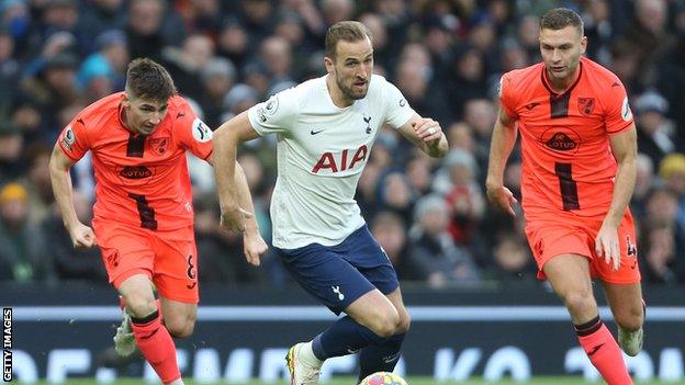 Billy Gilmour and Ben Gibson chase Tottenham striker Harry Kane