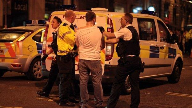 Police officers make an arrest in Cardiff, 2010