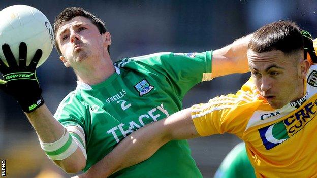 Mickey Jones of Fermanagh in action against Antrim forward Brian Neeson