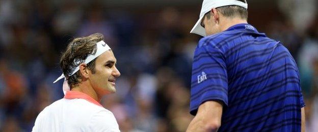 Roger Federer and John Isner