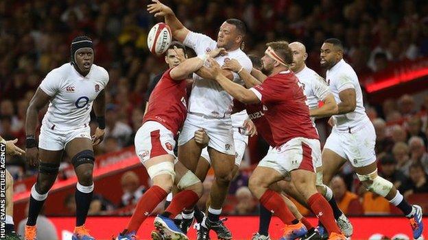 Wales prop Tomas Francis attempts to tackle Ellis Genge during an international in Cardiff in 2019