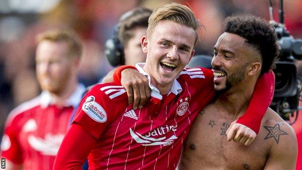 James Maddison is congratulated by Aberdeen team-mate Shay Logan after his stunning free-kick against Rangers