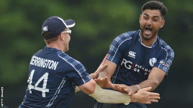 Safyaan Sharif celebrates taking England's final wicket