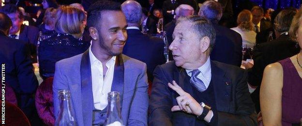 Lewis Hamilton in conversation with FIA president Jean Todt