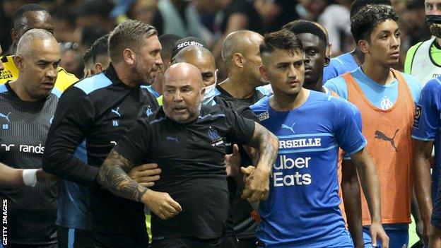 Marseille boss Jorge Sampaoli had to be held back by his staff during the trouble