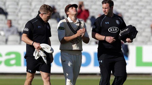 Zafar Ansari left the field with the Surrey physios after suffering his injury trying to stop an Ashwell Prince cover drive in mid-afternoon