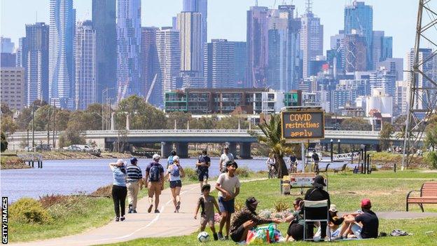 People walking along the Yarra River in Melbourne