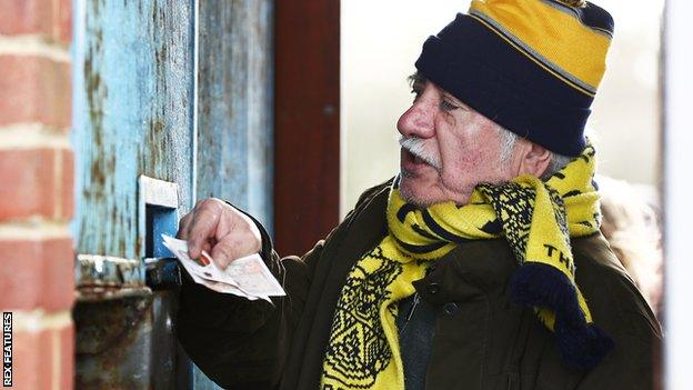 Slough Town fan buys a ticket