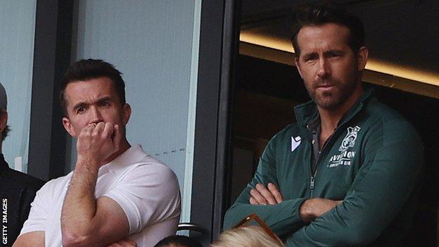 Rob McElhenney and Ryan Reynolds watch on from the stands as Wrexham are beaten by Bromley