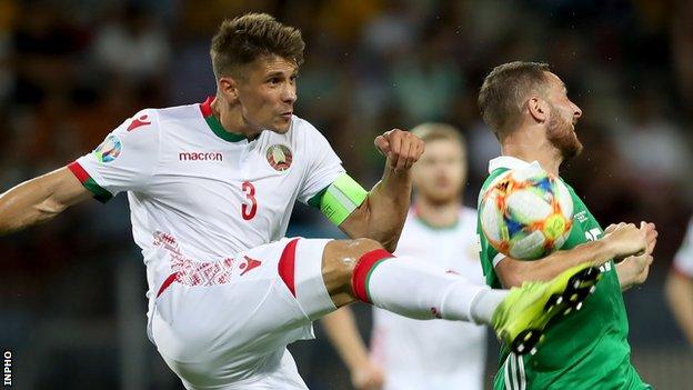 Aleksandr Martynovich in action against NI's Conor Washington