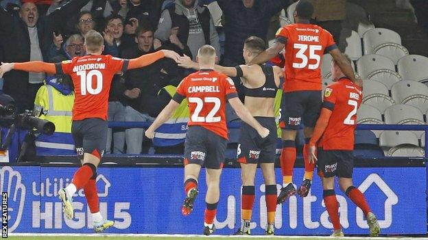 Reece Burke celebrates his winning goal for Luton at Huddersfield