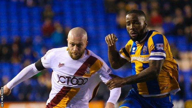 Abu Ogogo in action for Shrewsbury Town against Bradford City