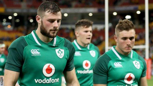 Robbie Henshaw (left), Jacob Stockdale (centre) and Jordan Larmour after Ireland's defeat in Brisbane