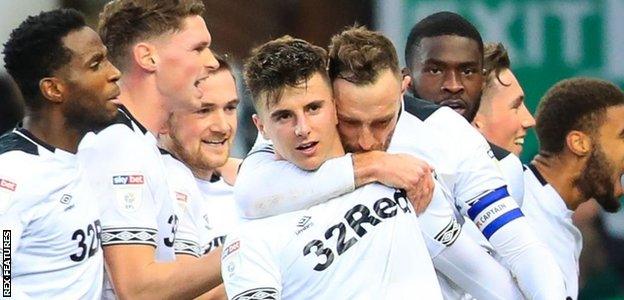 Derby players celebrate their winner