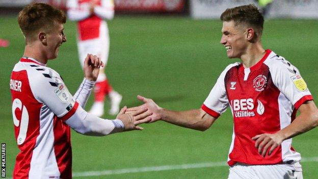 Fleetwood player Harvey Saunders (right) celebrates a goal with a team mate