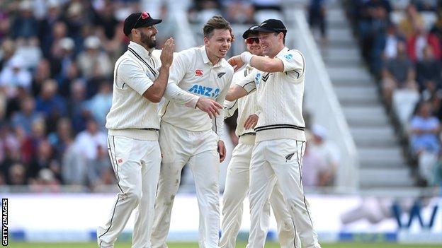 New Zealand's Michael Bracewell celebrates with teammates