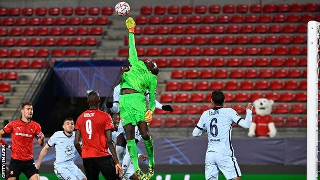 Edouard Mendy rises to palm away the ball