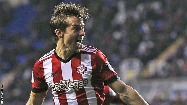 Lasse Vibe celebrates scoring a goal for Brentford