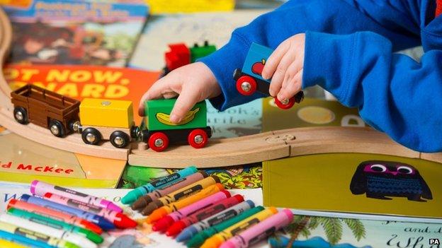 A toddler playing with toys