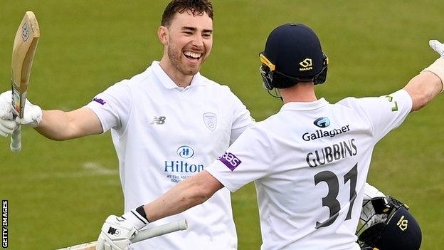 Joe Weatherley celebrates reaching his century with Nick Gubbins