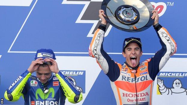 Marc Marquez celebrates winning the Australian Grand Prix next to second-placed Valentino Rossi