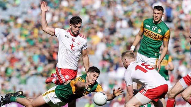 Frank Burns stoops to battle for possession with Kerry's Mike Breen