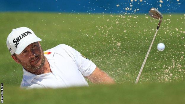 Graeme McDowell plays a bunker shot on the ninth hole during Sunday's final round