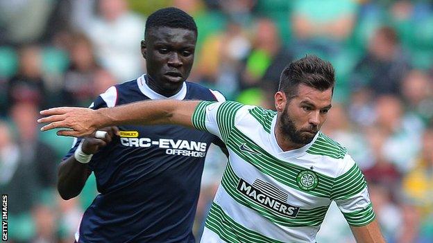 Kevin Luckassen (left) tussles with a Celtic player during his time at Ross County